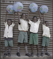 journal cover image of children holding globes overhead